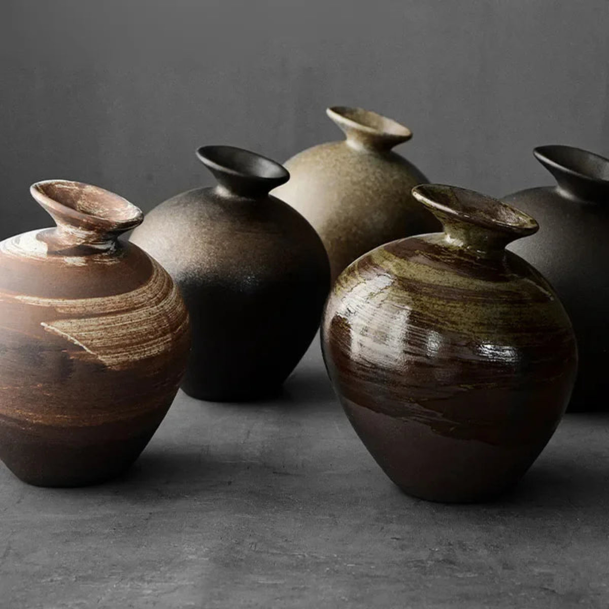 Japanese-inspired terracotta vase styled on a wooden console table