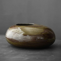 Tall sculptural ceramic vase with organic curved neck