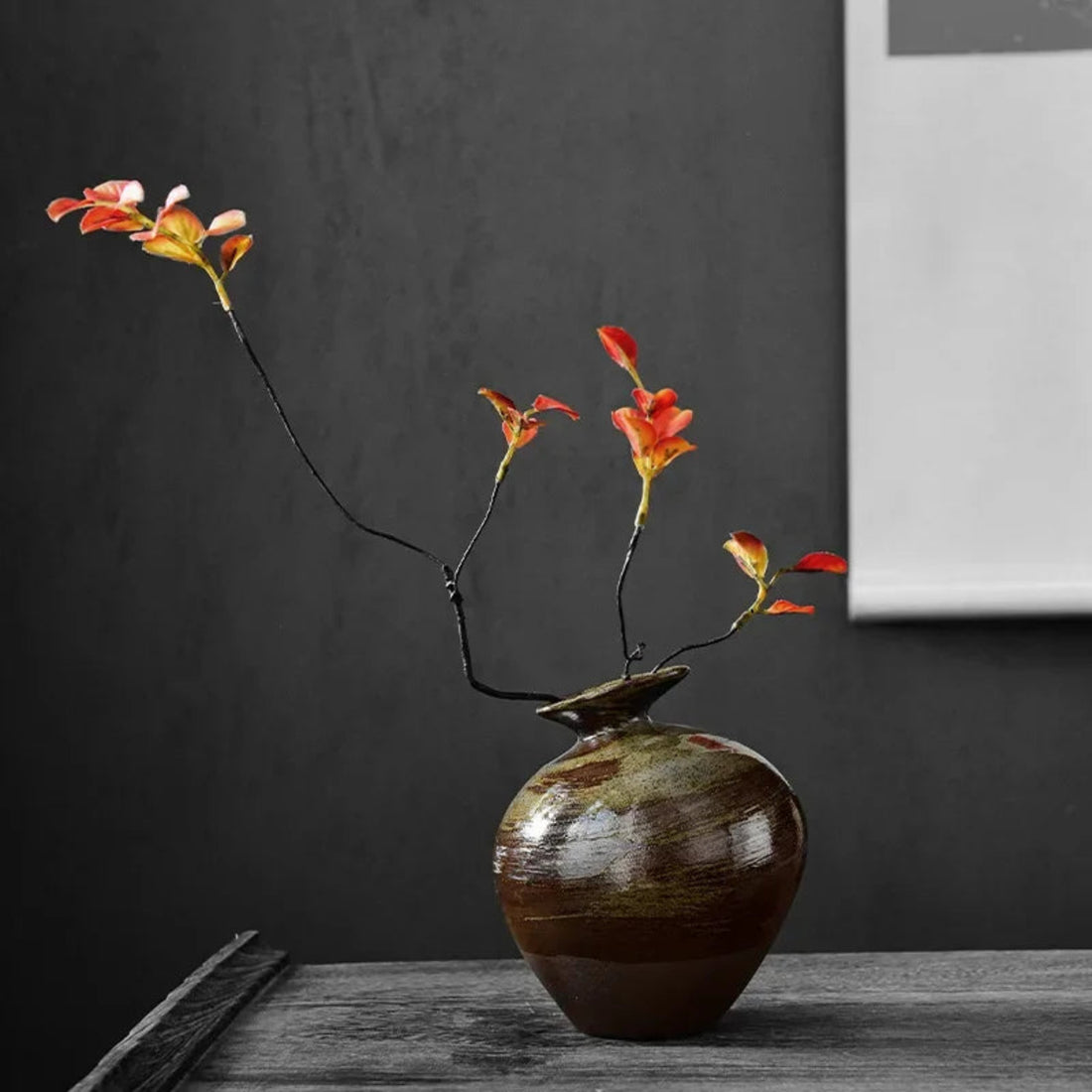 Handcrafted wabi-sabi ceramic vase with earthy glaze, close-up detail