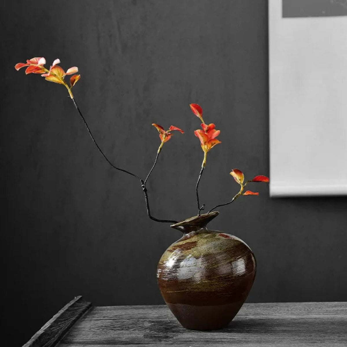 Handcrafted wabi-sabi ceramic vase with earthy glaze, close-up detail